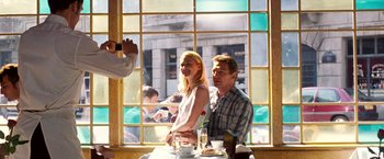 Movie still from “Unknown” (2011), directed by Jaume Collet-Serra – A man and a woman sitting in front of a window; Medium shot, Over the shoulder angle