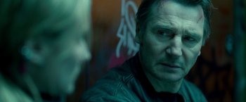 Movie still from “Unknown” (2011), directed by Jaume Collet-Serra – A person wearing a leather jacket; Close Up shot, Over the shoulder angle