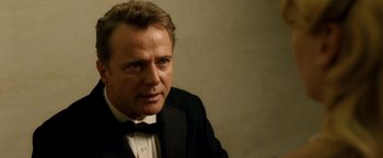 Movie still from “Unknown” (2011), directed by Jaume Collet-Serra – A person wearing a tuxedo; Close Up shot, Over the shoulder angle