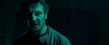 Movie still from “Unknown” (2011), directed by Jaume Collet-Serra – A person wearing a green shirt; Close Up shot, Low angle