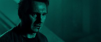 Movie still from “Unknown” (2011), directed by Jaume Collet-Serra – A person in a dark room; Close Up shot, Low angle