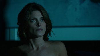 Movie still from “Urge” (2016), directed by Aaron Kaufman – A beautiful woman sitting in front of a window; Close Up shot, Over the shoulder angle