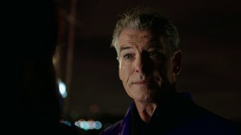 Movie still from “Urge” (2016), directed by Aaron Kaufman – An older man with gray hair looking at the camera; Close Up shot, Over the shoulder angle