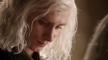 Movie still from “Game of Thrones” (2011), created by D.B. Weiss – A person with long white hair; Close Up shot, Over the shoulder angle