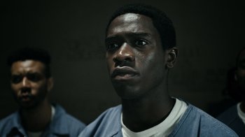 Movie still from “Snowfall” (2017), directed by Hiro Murai – A person wearing a blue shirt; Close Up shot, Low angle