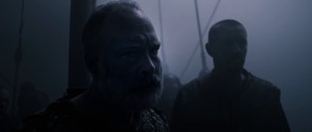 Movie still from “Valhalla Rising” (2009), directed by Nicolas Winding Refn – A man with a goatee and a beard; Close Up shot, Low angle