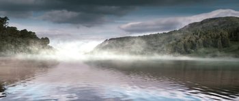 Movie still from “Valhalla Rising” (2009), directed by Nicolas Winding Refn – A body of water near a wooded area with fog; Extreme Wide shot, Low angle