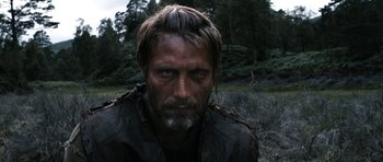 Movie still from “Valhalla Rising” (2009), directed by Nicolas Winding Refn – A person with a beard; Close Up shot, Over the shoulder angle