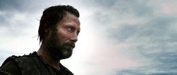 Movie still from “Valhalla Rising” (2009), directed by Nicolas Winding Refn – A person with a beard looking to the side; Close Up shot, Low angle
