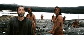 Movie still from “Valhalla Rising” (2009), directed by Nicolas Winding Refn – A group of native americans standing on top of a hill; Medium shot, Over the shoulder angle