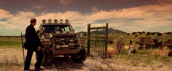 Movie still from “Vampires” (1998), directed by John Carpenter – An old truck parked in the middle of a field; Wide shot, Low angle