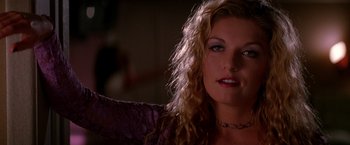 Movie still from “Vampires” (1998), directed by John Carpenter – A person wearing a purple shirt; Close Up shot, Low angle