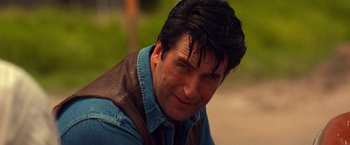 Movie still from “Vampires” (1998), directed by John Carpenter – A person wearing a jacket; Close Up shot, Low angle