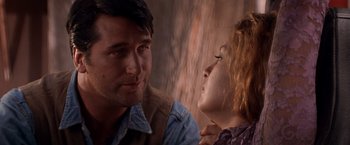 Movie still from “Vampires” (1998), directed by John Carpenter – A man and a woman looking at one another; Close Up shot, Over the shoulder angle