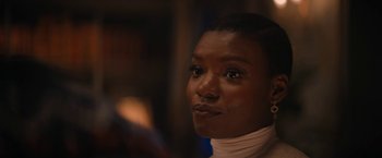 Movie still from “Violent Night” (2022), directed by Tommy Wirkola – A person wearing a white shirt; Close Up shot, Over the shoulder angle