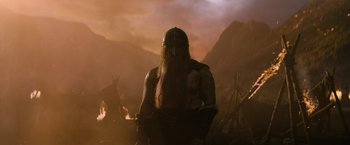 Movie still from “Violent Night” (2022), directed by Tommy Wirkola – An image of a man with a long beard in the middle of the night; Medium shot, Low angle