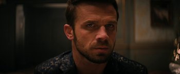 Movie still from “Violent Night” (2022), directed by Tommy Wirkola – A person with a beard; Close Up shot, Over the shoulder angle