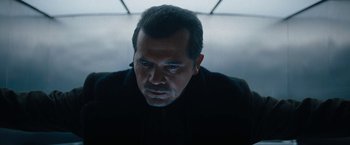 Movie still from “Violent Night” (2022), directed by Tommy Wirkola – A person wearing a black shirt; Close Up shot, Low angle