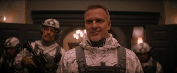 Movie still from “Violent Night” (2022), directed by Tommy Wirkola – A person wearing a uniform; Close Up shot, Low angle