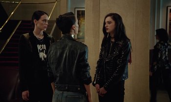 Movie still from “Vox Lux” (2018), directed by Brady Corbet – A group of women standing next to each other; Medium shot, Over the shoulder angle