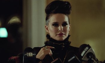 Movie still from “Vox Lux” (2018), directed by Brady Corbet – A woman in a black dress with a cigarette in her mouth; Close Up shot, Over the shoulder angle