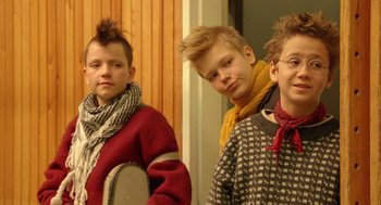 A group of young men standing next to each other