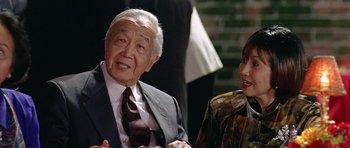 Movie still from “Wedding Crashers” (2005), directed by David Dobkin – An older man and a younger woman sitting next to each other; Close Up shot, Over the shoulder angle