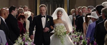 Movie still from “Wedding Crashers” (2005), directed by David Dobkin – A man and a woman walking down the aisle together; Medium shot, Over the shoulder angle