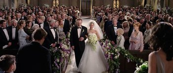 Movie still from “Wedding Crashers” (2005), directed by David Dobkin – A bride and groom walking down the aisle of a church; Wide shot, High angle