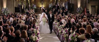 Movie still from “Wedding Crashers” (2005), directed by David Dobkin – A bride and groom walking down the aisle; Wide shot, High angle
