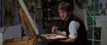 Movie still from “Wedding Crashers” (2005), directed by David Dobkin – A young man holding a paintbrush and a palette; Medium shot, Over the shoulder angle