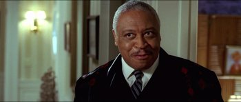 Movie still from “Wedding Crashers” (2005), directed by David Dobkin – An older man wearing a suit and tie; Close Up shot, Low angle