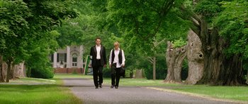 Movie still from “Wedding Crashers” (2005), directed by David Dobkin – Two people walking down the street holding hands; Wide shot, Low angle