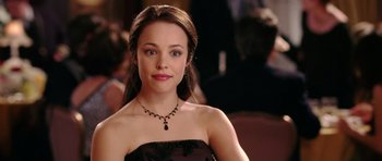 Movie still from “Wedding Crashers” (2005), directed by David Dobkin – A woman in a black dress and a black necklace; Close Up shot, High angle