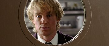 Movie still from “Wedding Crashers” (2005), directed by David Dobkin – A person looking at a mirror; Close Up shot, Over the shoulder angle