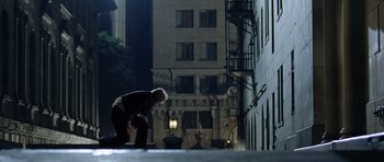 Movie still from “Wedding Crashers” (2005), directed by David Dobkin – A man is bending down on his skateboard; Wide shot, Low angle