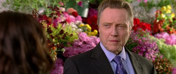 Movie still from “Wedding Crashers” (2005), directed by David Dobkin – A person wearing a suit and tie; Close Up shot, Over the shoulder angle