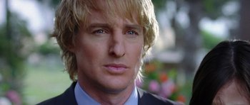 Movie still from “Wedding Crashers” (2005), directed by David Dobkin – A person with long blonde hair; Close Up shot, Over the shoulder angle