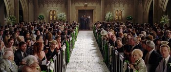 Movie still from “Wedding Crashers” (2005), directed by David Dobkin – A crowd of people sitting at a wedding ceremony; Wide shot, High angle