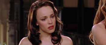 Movie still from “Wedding Crashers” (2005), directed by David Dobkin – A beautiful woman with long hair and a bare chest; Close Up shot, Over the shoulder angle