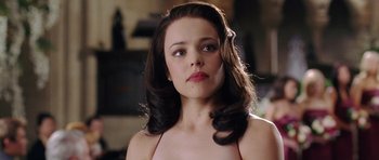 Movie still from “Wedding Crashers” (2005), directed by David Dobkin – A young woman with long hair and a bare chest; Close Up shot, Over the shoulder angle