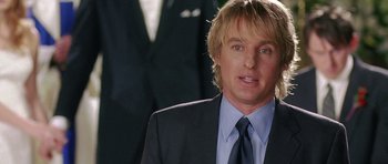 Movie still from “Wedding Crashers” (2005), directed by David Dobkin – A person wearing a suit and a tie; Close Up shot, Over the shoulder angle