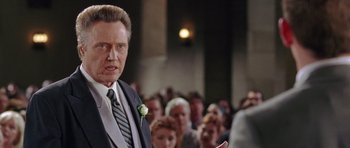Movie still from “Wedding Crashers” (2005), directed by David Dobkin – An older man in a suit and a tie; Close Up shot, Low angle