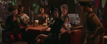 Movie still from “Welcome to Marwen” (2018), directed by Robert Zemeckis – A group of women sitting at a bar; Medium shot, Low angle