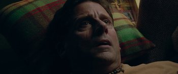 Movie still from “Welcome to Marwen” (2018), directed by Robert Zemeckis – A man's face as he lies in bed; Close Up shot, Overhead angle