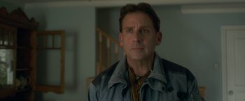 Movie still from “Welcome to Marwen” (2018), directed by Robert Zemeckis – A person wearing a jacket; Close Up shot, Over the shoulder angle