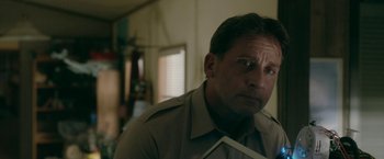 Movie still from “Welcome to Marwen” (2018), directed by Robert Zemeckis – A person wearing a shirt and tie; Close Up shot, Over the shoulder angle