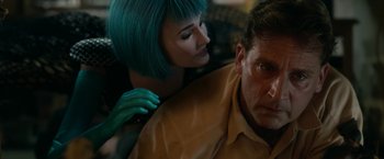 Movie still from “Welcome to Marwen” (2018), directed by Robert Zemeckis – A man and a woman with blue hair and a green wig; Close Up shot, Over the shoulder angle