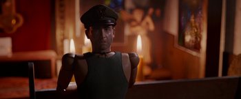 Movie still from “Welcome to Marwen” (2018), directed by Robert Zemeckis – A man wearing a hat standing in front of candles; Close Up shot, Low angle