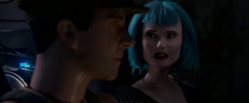 Movie still from “Welcome to Marwen” (2018), directed by Robert Zemeckis – A man and a woman with blue hair looking at each other; Close Up shot, Over the shoulder angle